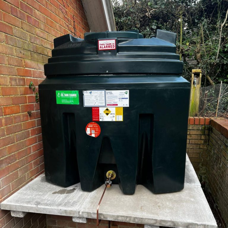 raised oil tank beside house