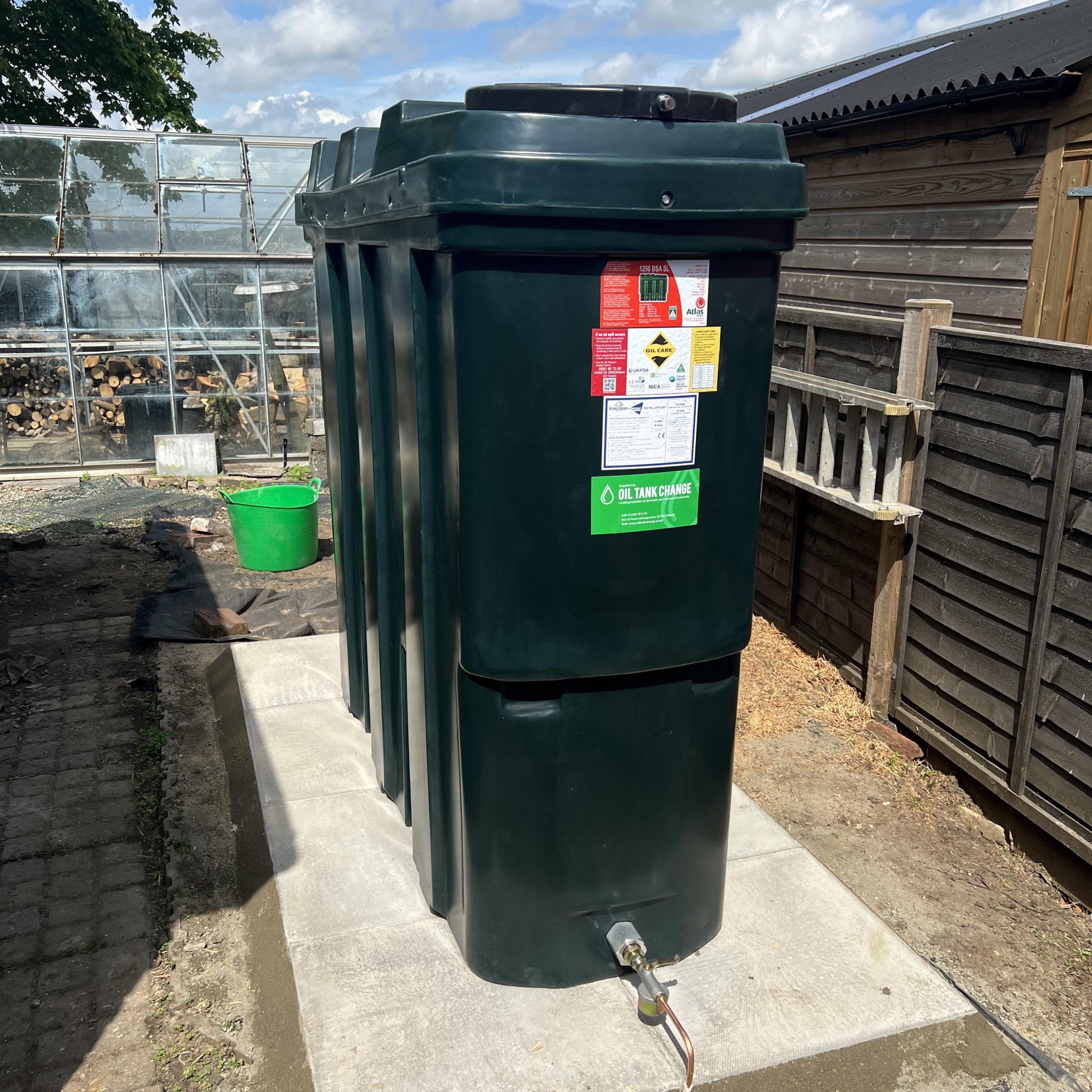 slim green domestic oil tank
